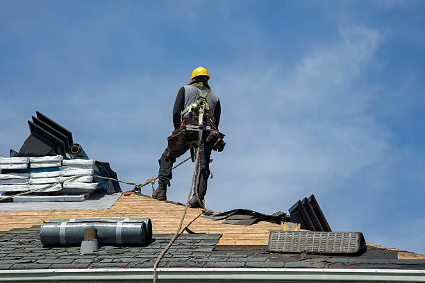 Professional Roof Replacement technician working in Adrian, MO